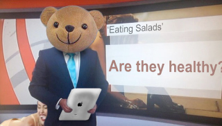 Illustration for article titled 22 Photos of a Reporter Holding Inappropriate Things That Aren't iPads